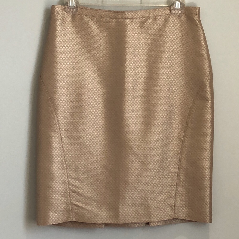 BCBG Maxazria skirt. Lined. Back zipper. Gold color. Size 4. Great condition